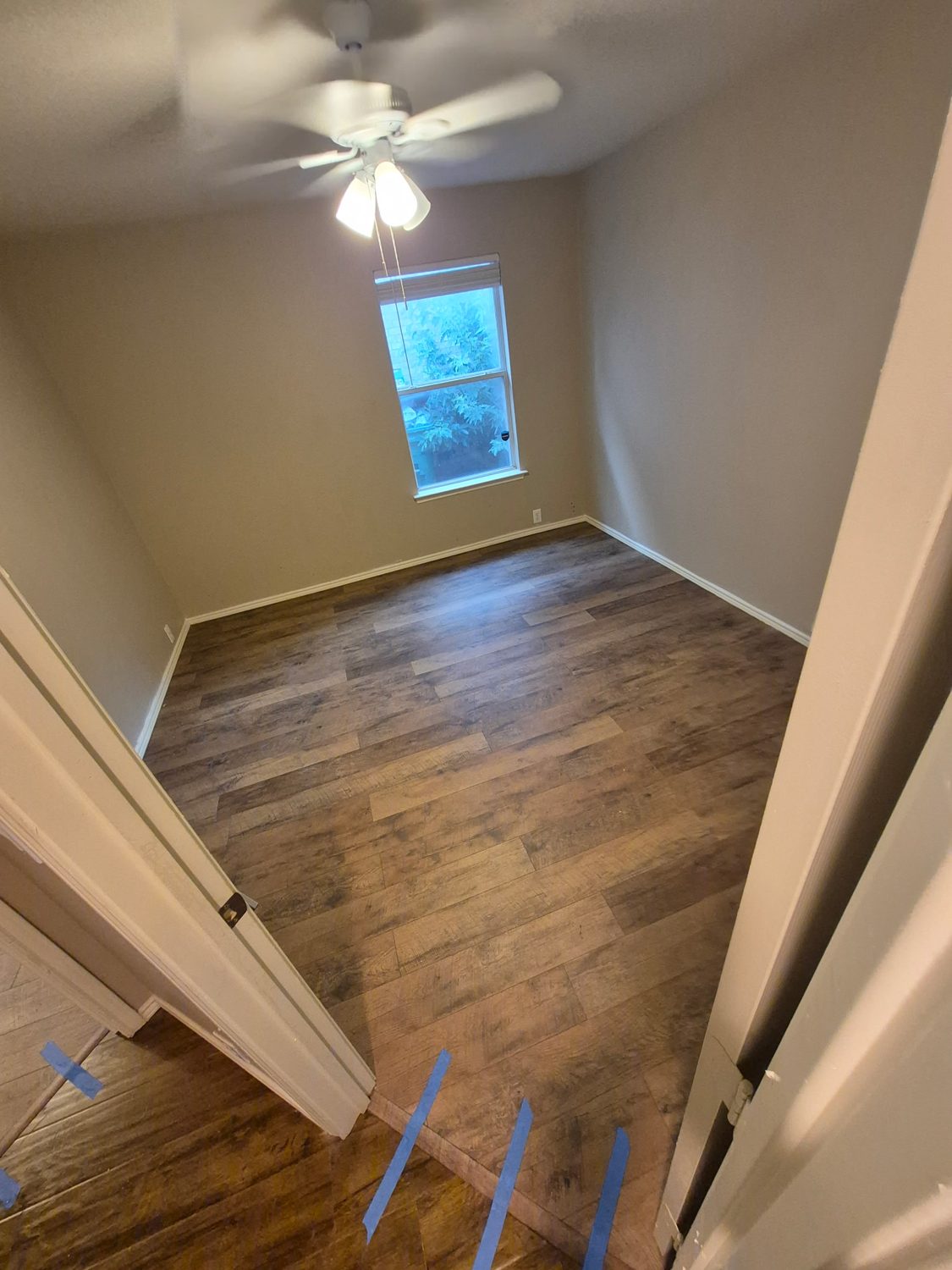 Bedroom with new vinyl plank flooring after