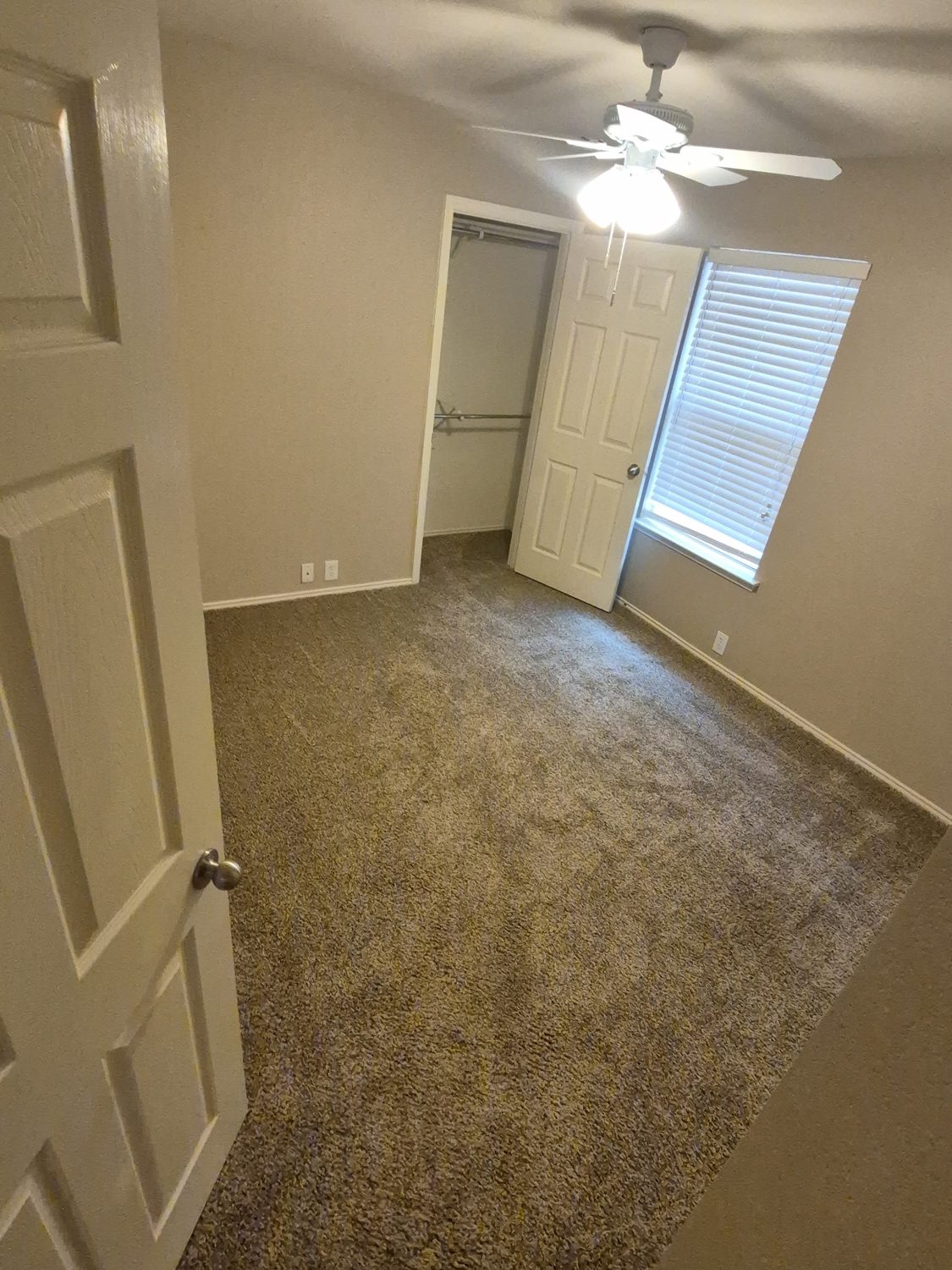 Bedroom with old carpet before