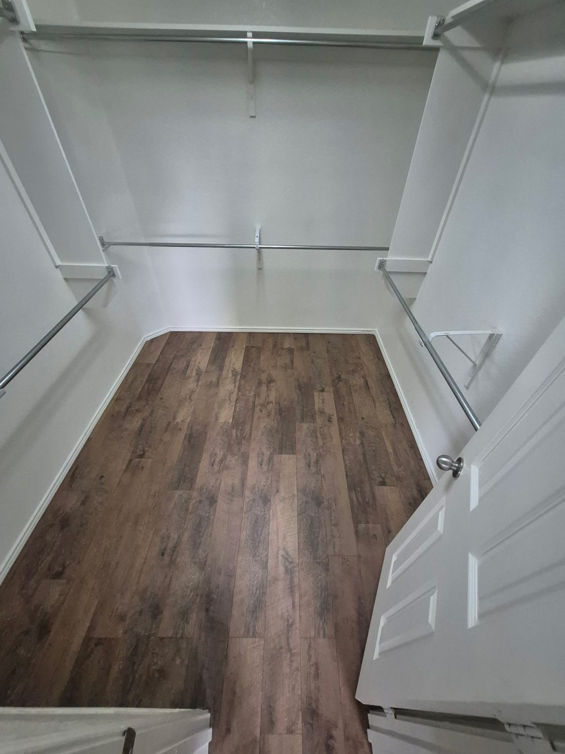 Walk-in closet with new flooring after
